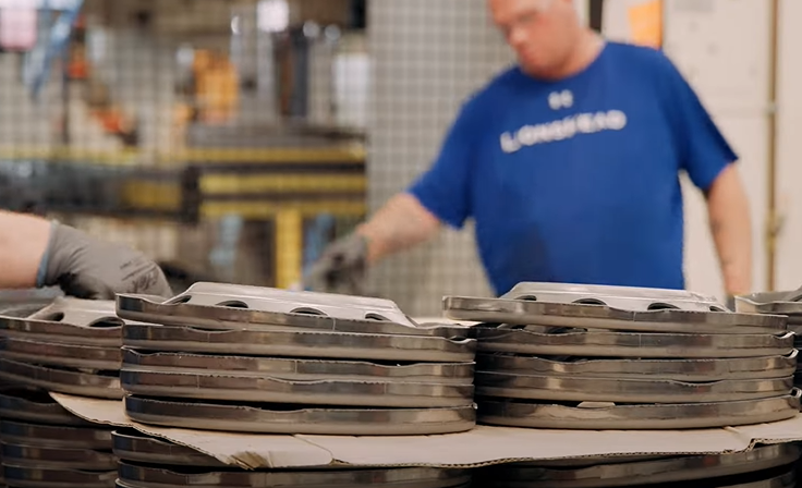 Wheel discs are stacked after being stamped. Wheel discs are stacked after being stamped.